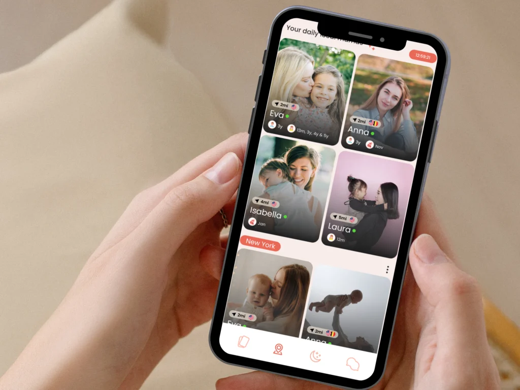 Hands holding a phone showing daily local mom matches in the MamaMeet app